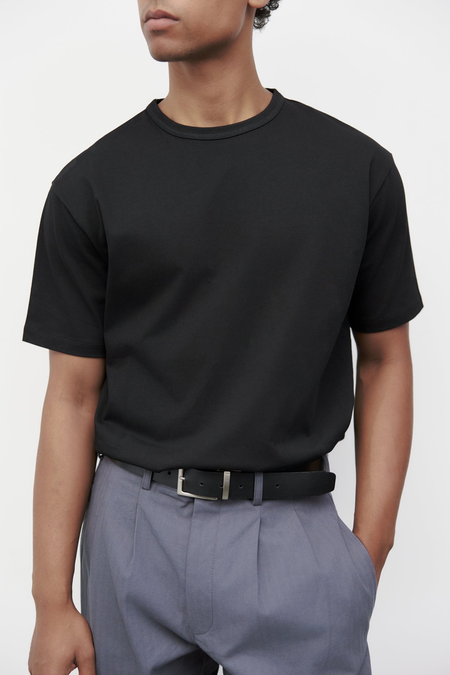 Model wearing black elias top, close up view 