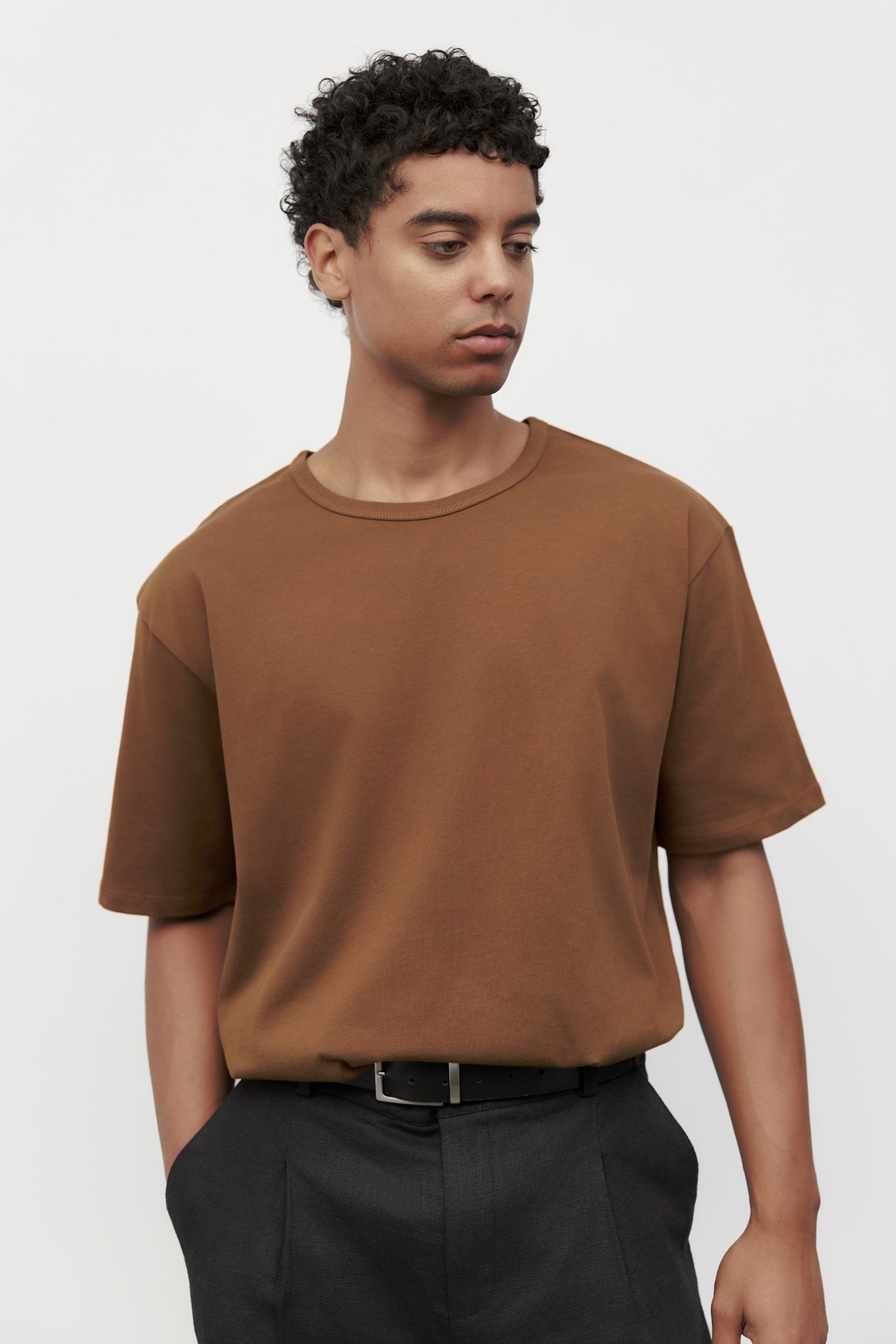 Model wearing brown elias top, close up view