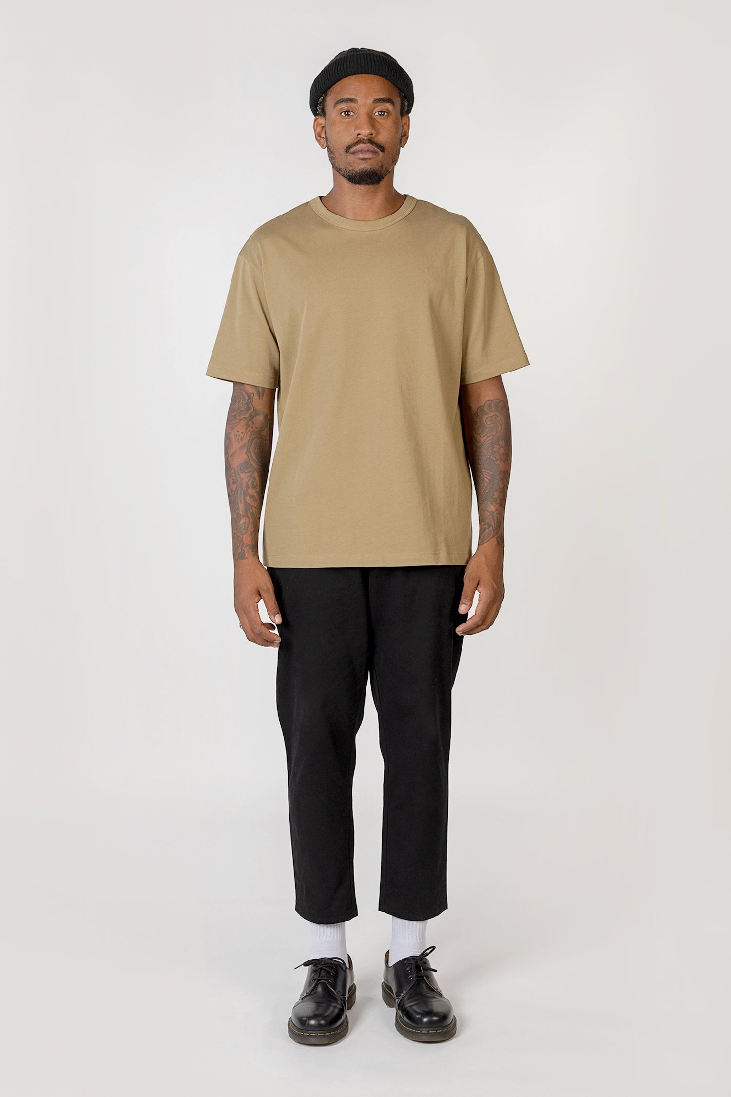 Model wearing light olve elias top, front view