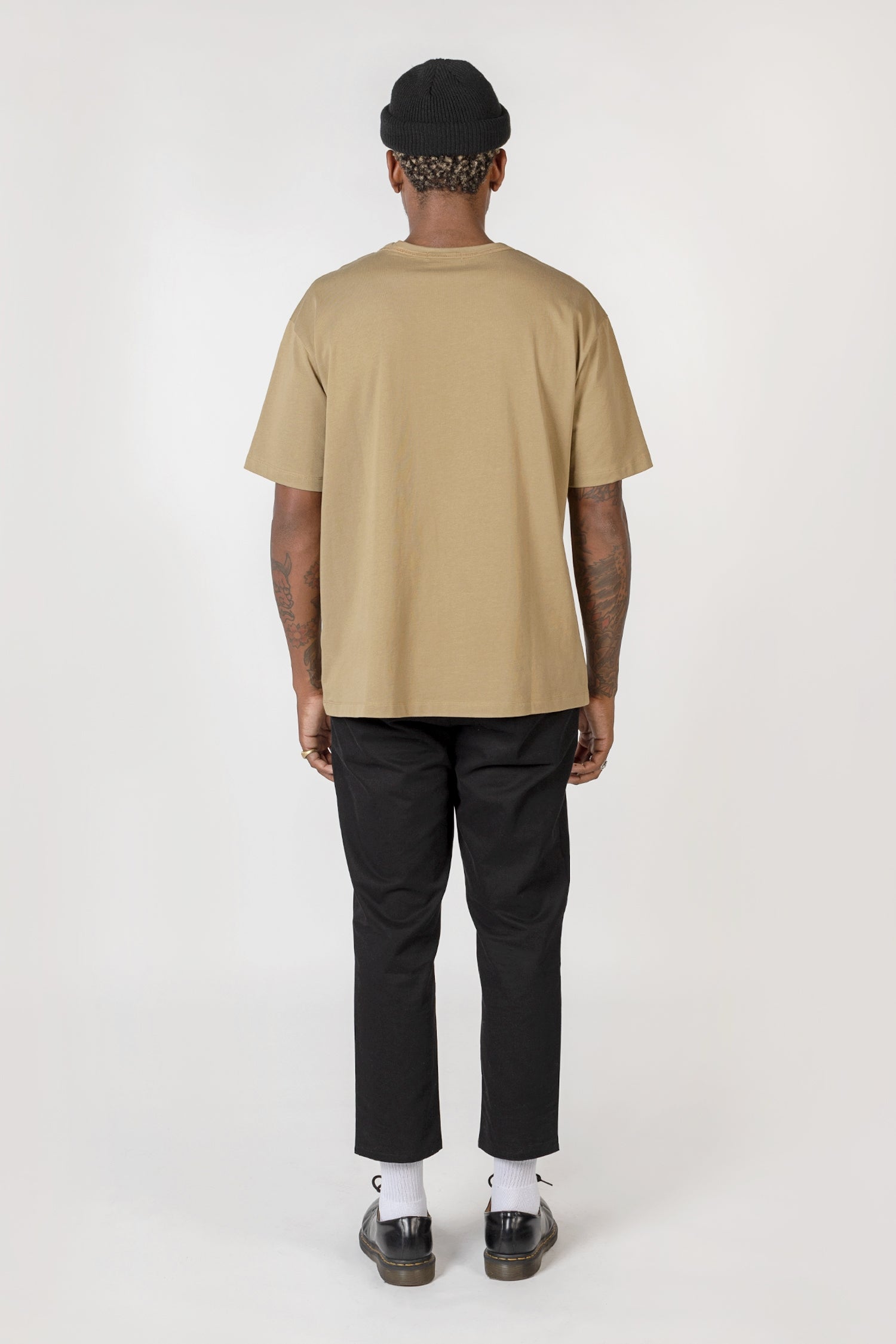 Model wearing olive elias top, back view