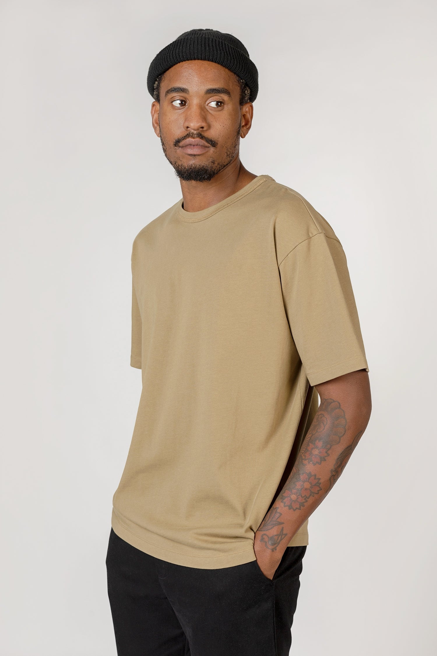 Model wearing olive elias top, close up view