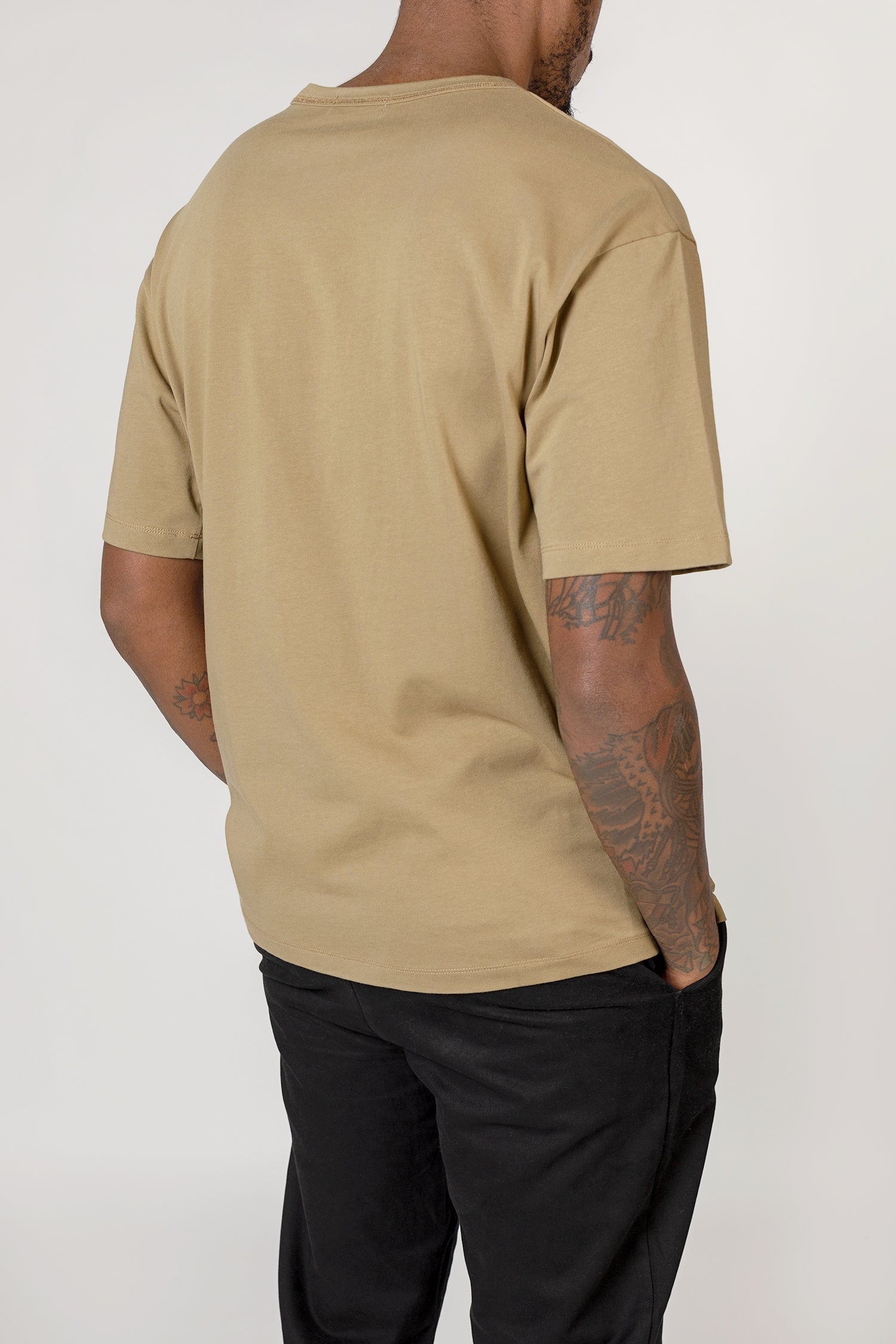 Model wearing black elias top, back close up view
