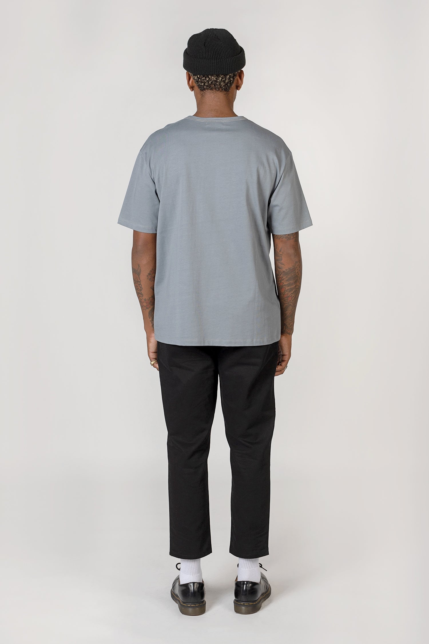 Model wearing Slate blue elias top, back view
