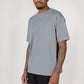 Model wearing slate blue Elias top, close up view