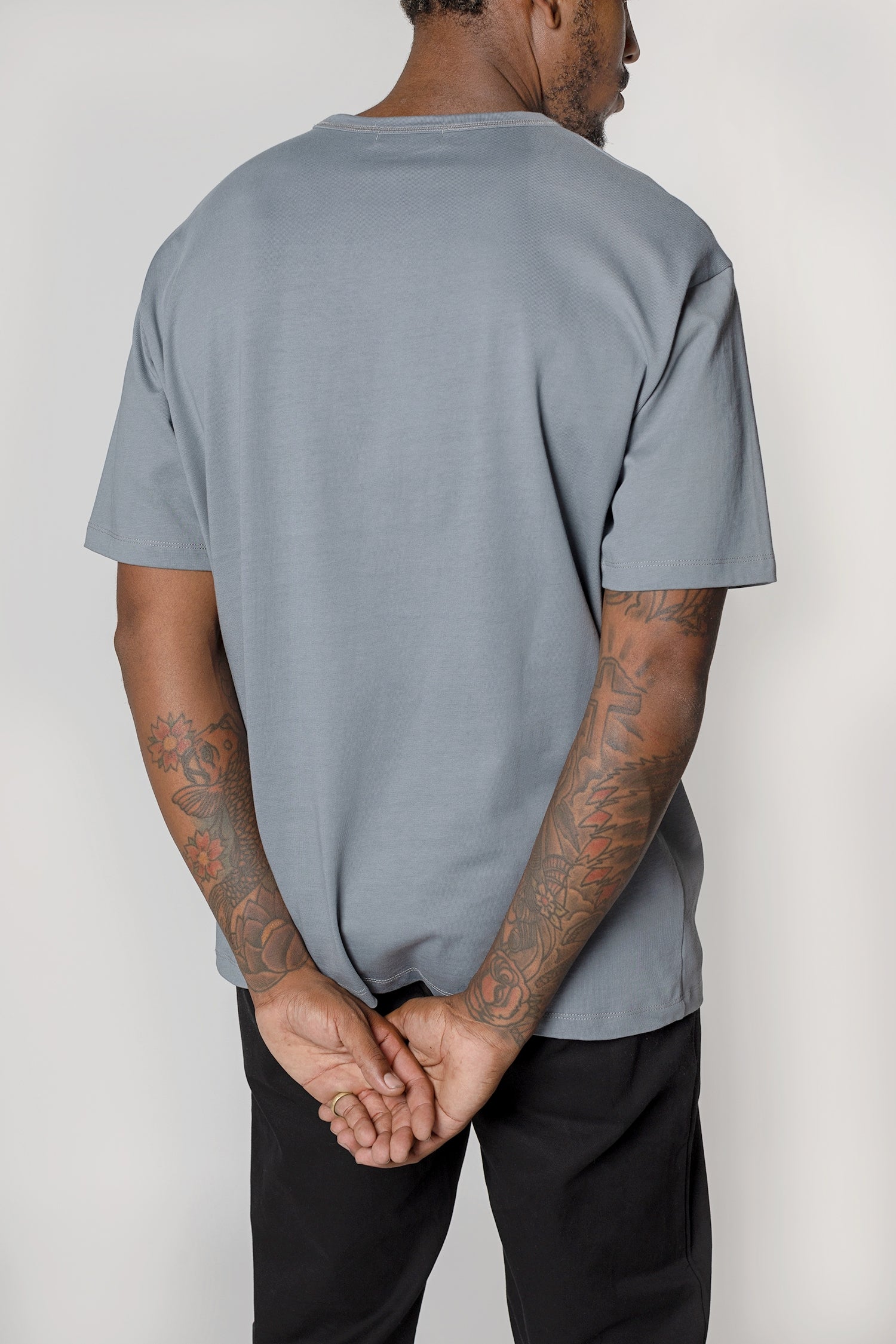 Model wearing Slate blue elias top, close up back view